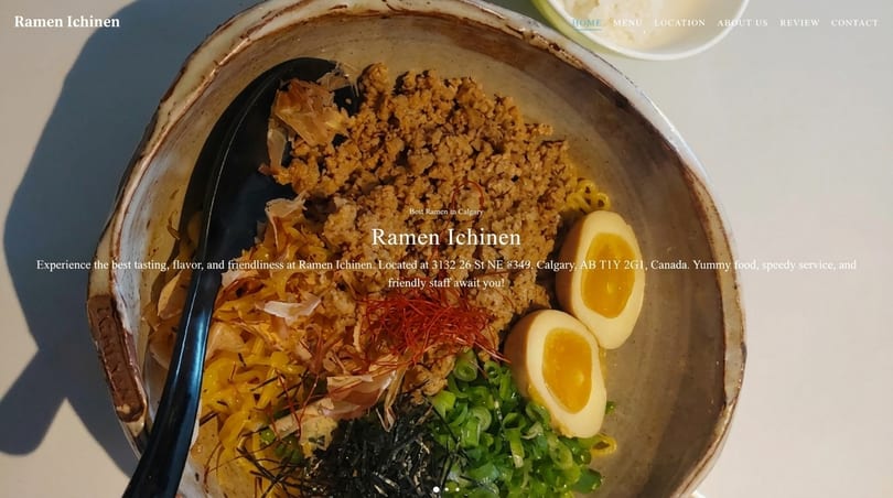 Rustic bowl of Ramen Ichinen with ground meat, soft-boiled eggs, green onions, and bonito flakes.